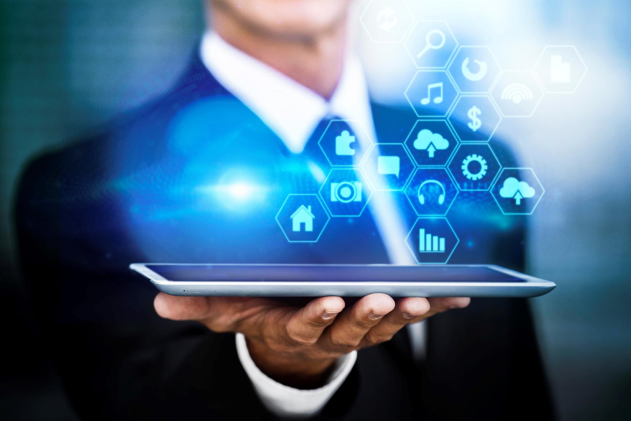 TechX consultant reviewing a digital platform on a tablet